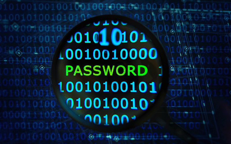 A magnifying glass focuses in on the word Password in green amidst blue 1s and 0s